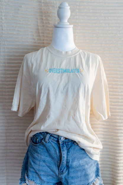 overstimulated tee shirt and long sleeves